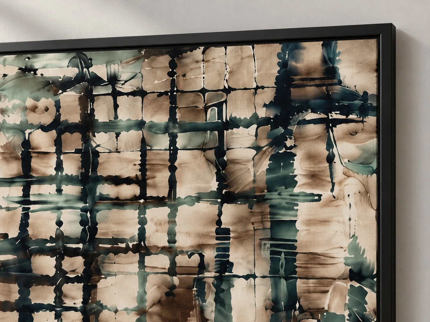 Framed teal and black plaid art, frame corner detail